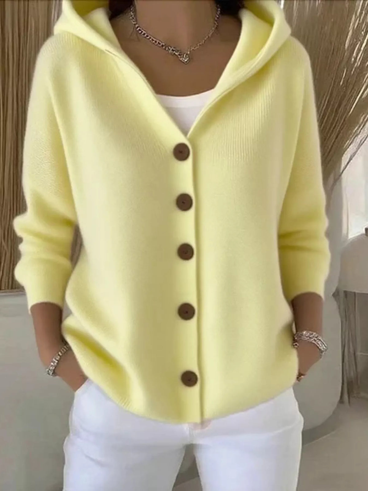Light yellow hooded knit cardigan, button-front placket and long sleeves