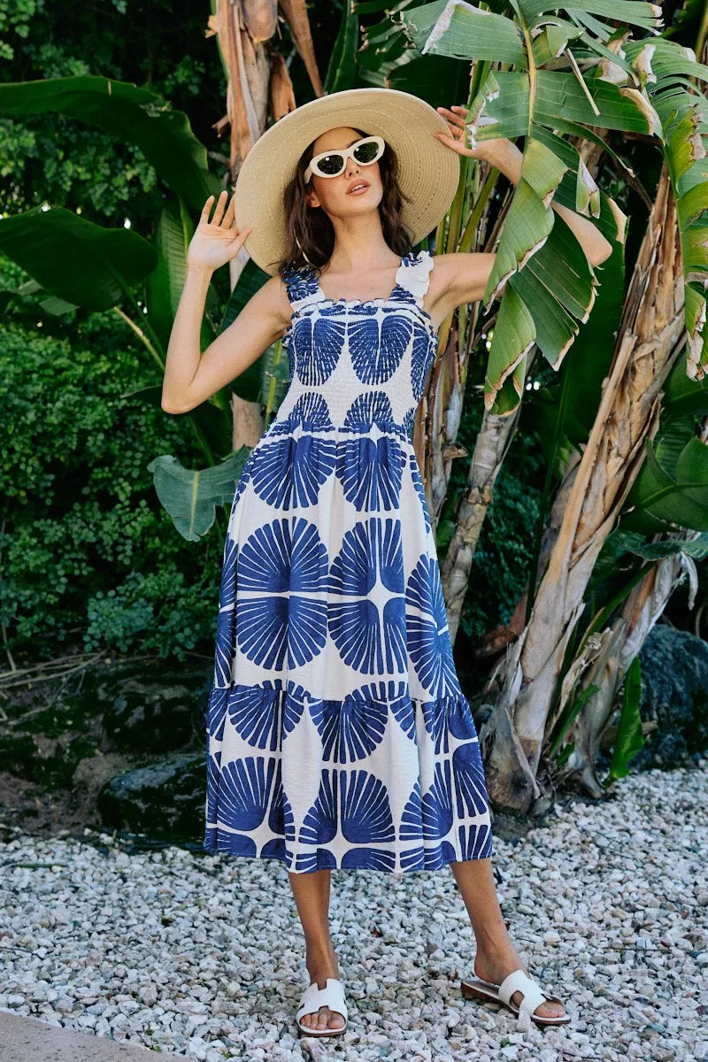 Navy and white abstract print sleeveless midi dress with smocked bodice, tiered silhouette