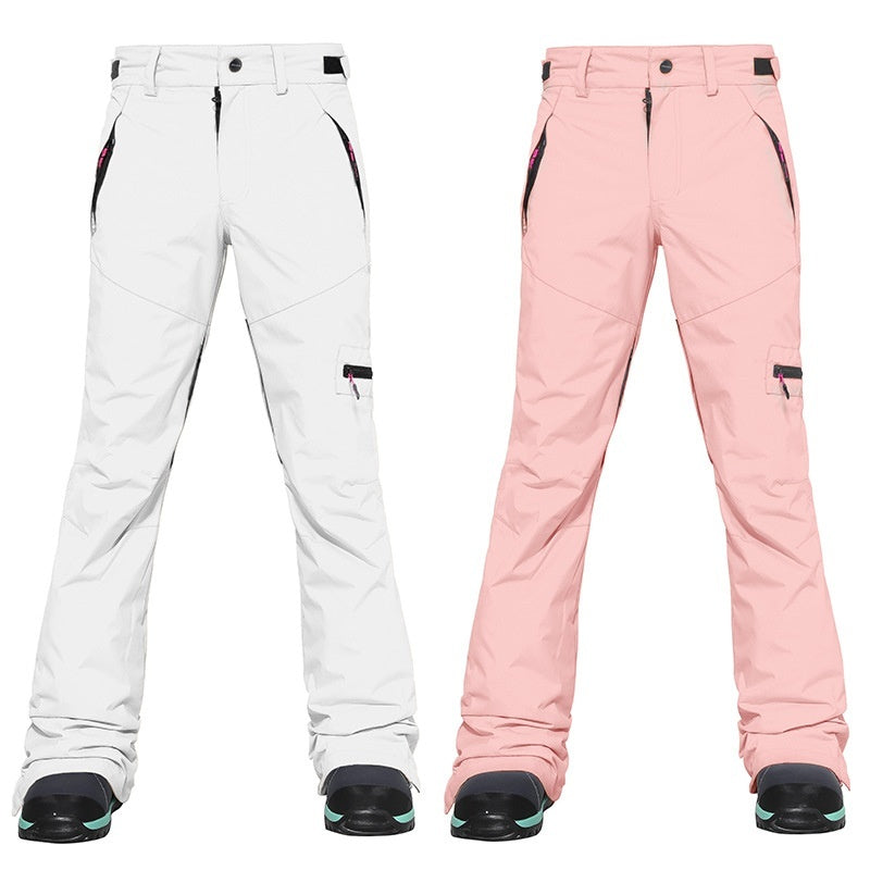 Women's ski pants, white and blush pink options, cargo pocket details and ankle cuffs