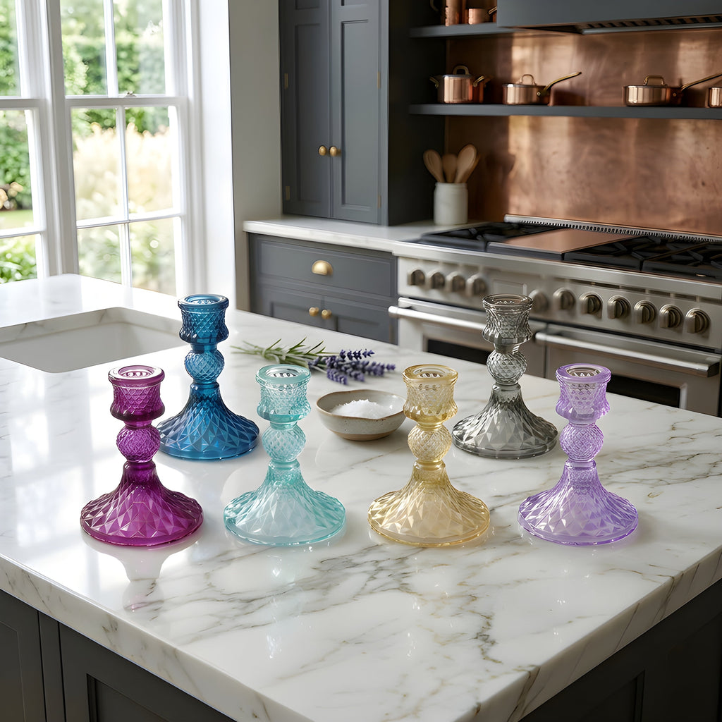 Glass taper holder set on countertop with smoke-gray, blue, purple, and clear shades