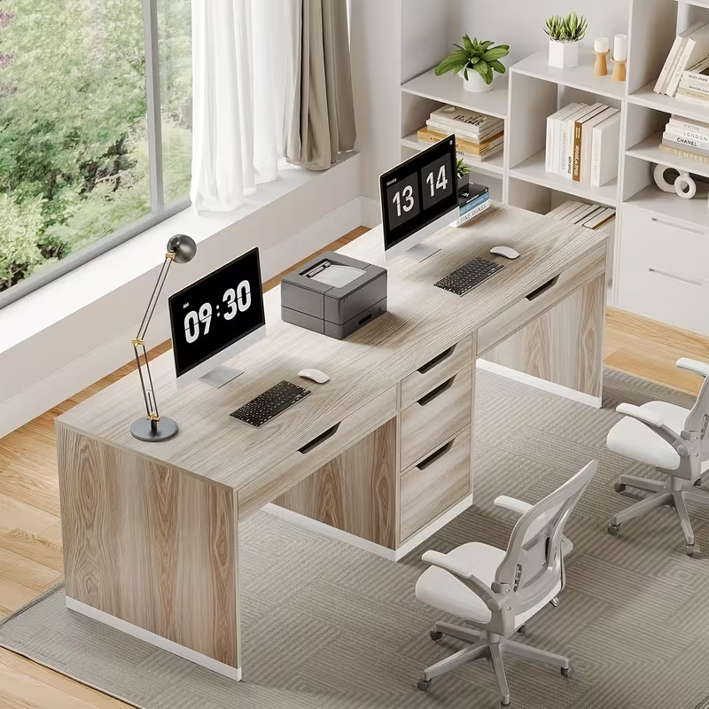 Light wood two-person desk with multiple under-top drawers and corner shelves.