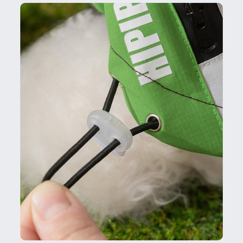 Waterproof dog jacket hood drawcord with green fabric panel and plastic stopper