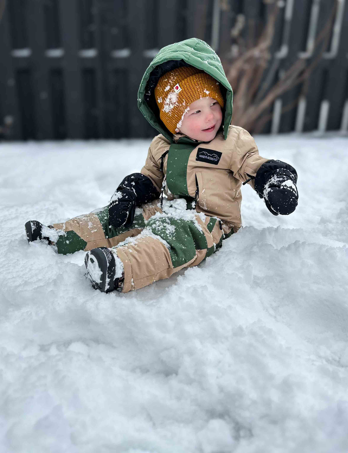 Kids hooded snowsuit beige and green, snow-ready one-piece with zip front