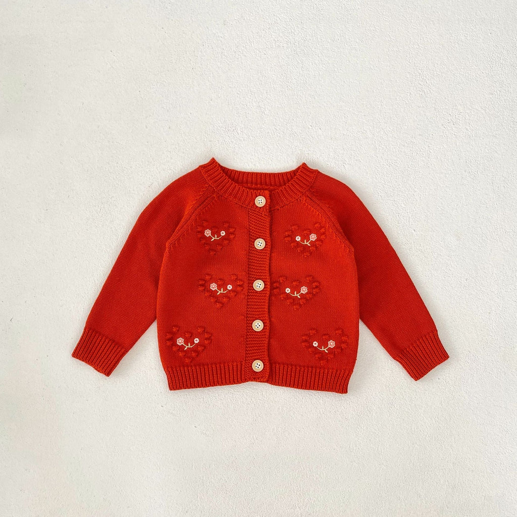 Red knit baby girl cardigan romper with small embroidered heart designs and button placket