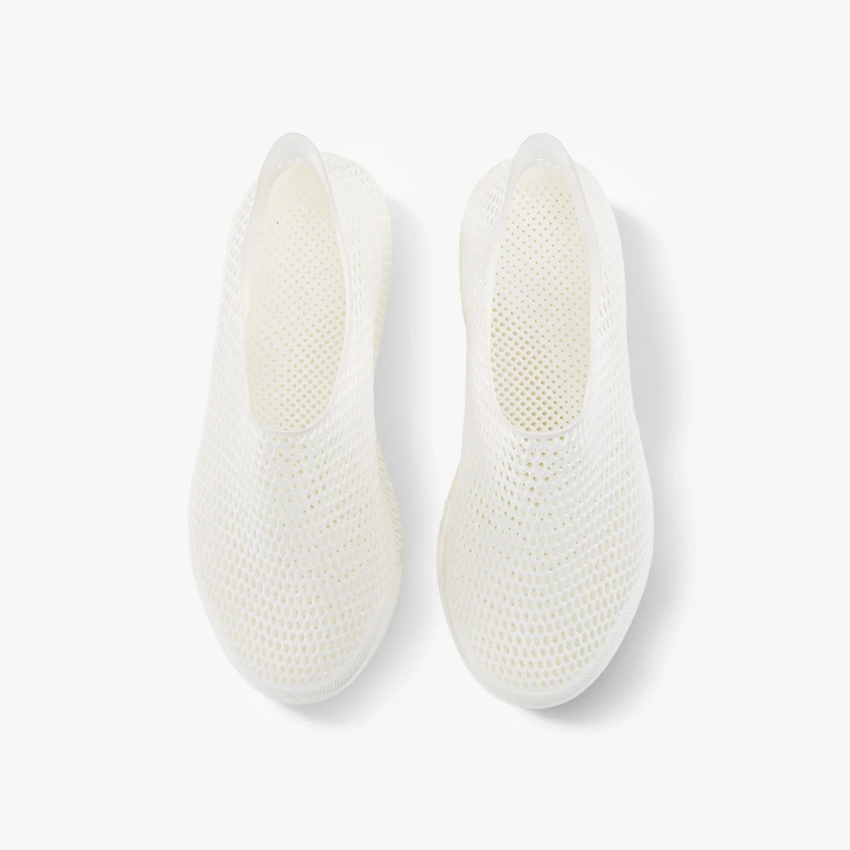 Pair of white 3D-printed slip-on sneakers, inside views