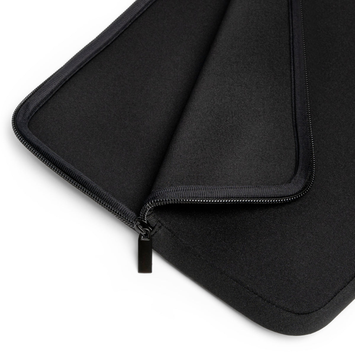 Black laptop sleeve interior lining with zipper close-up