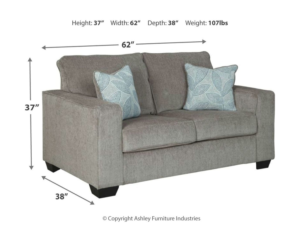 Light gray upholstered sofa with blue accent pillows and measurements