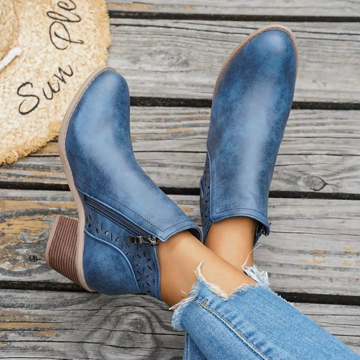 Blue ankle boots with block heel and side zipper with cutout detailing