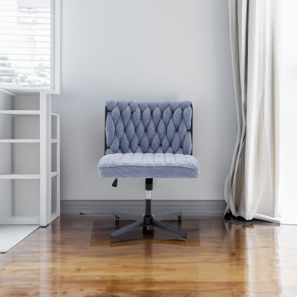 Blue armless desk chair with tufted back, padded seat, and black star base
