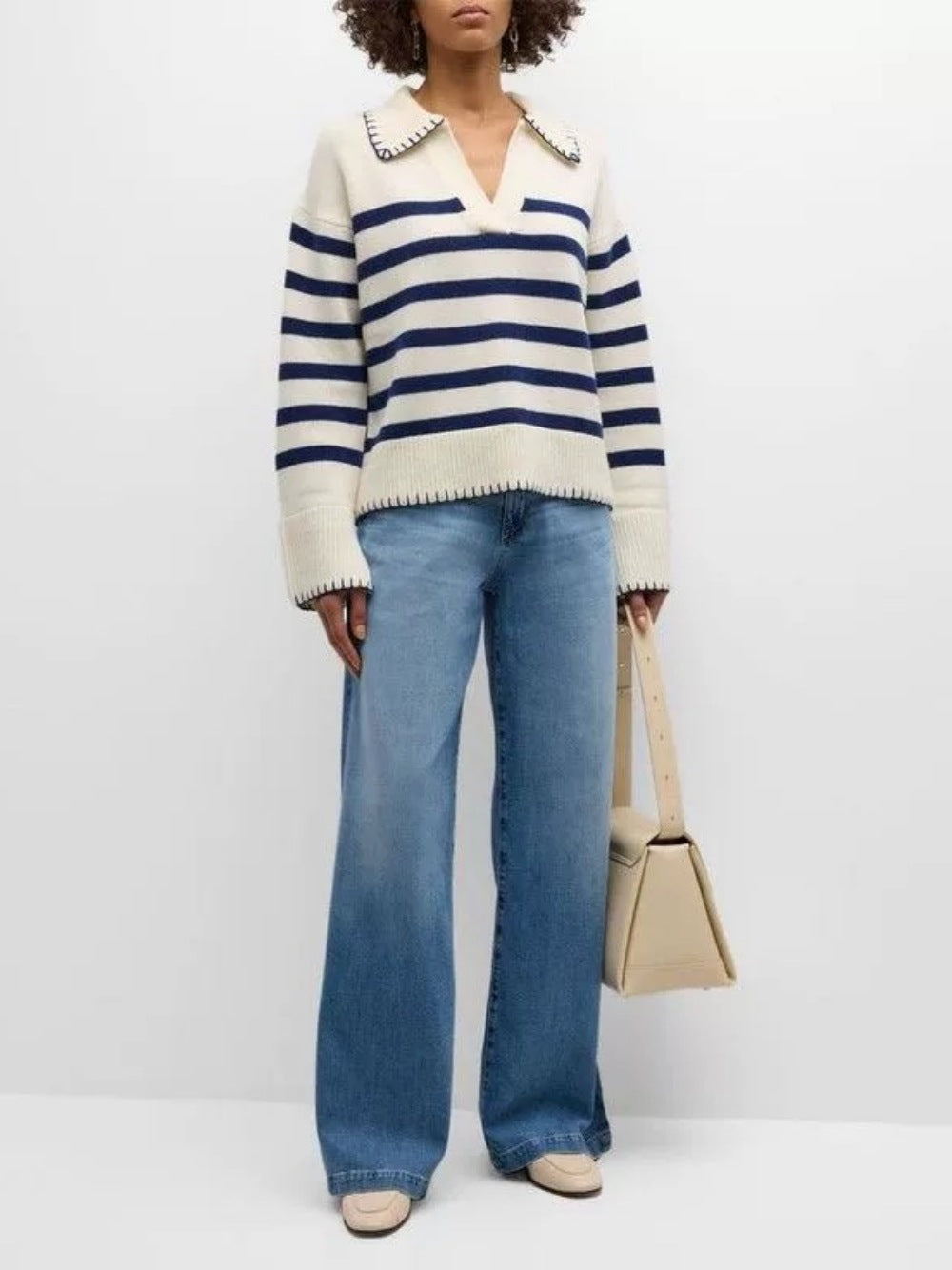 Women’s cream-and-navy striped knit polo sweater with ribbed V-neck collar and cuffs