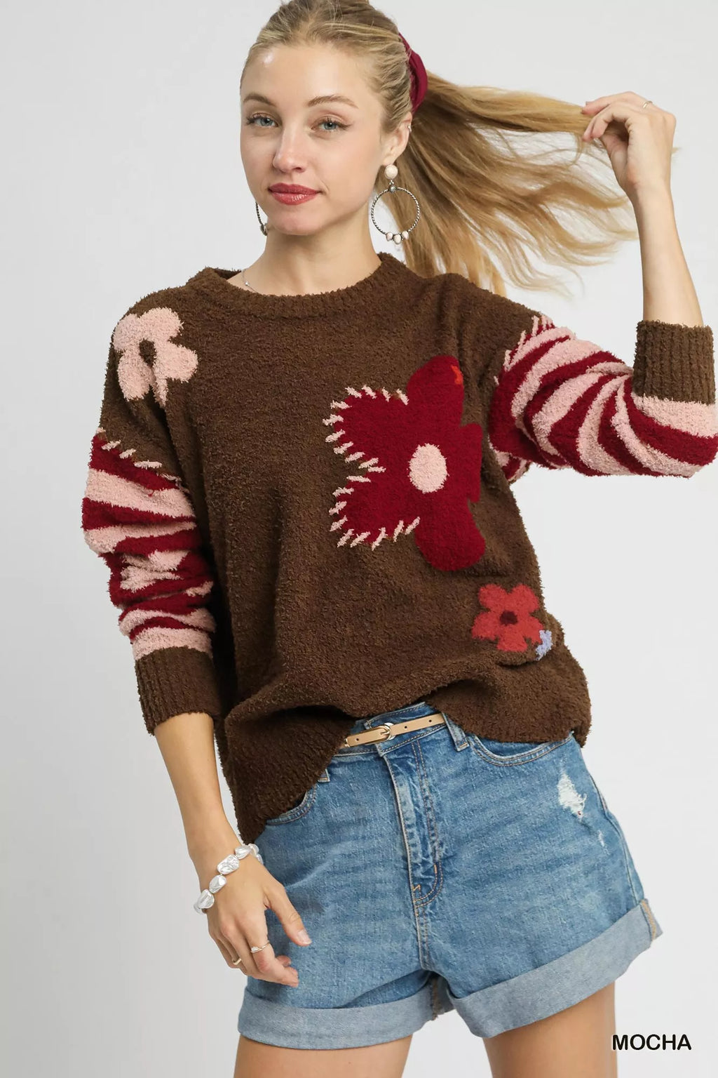 Mocha brown long-sleeve sweater with striped cuffs and red flower jacquard front
