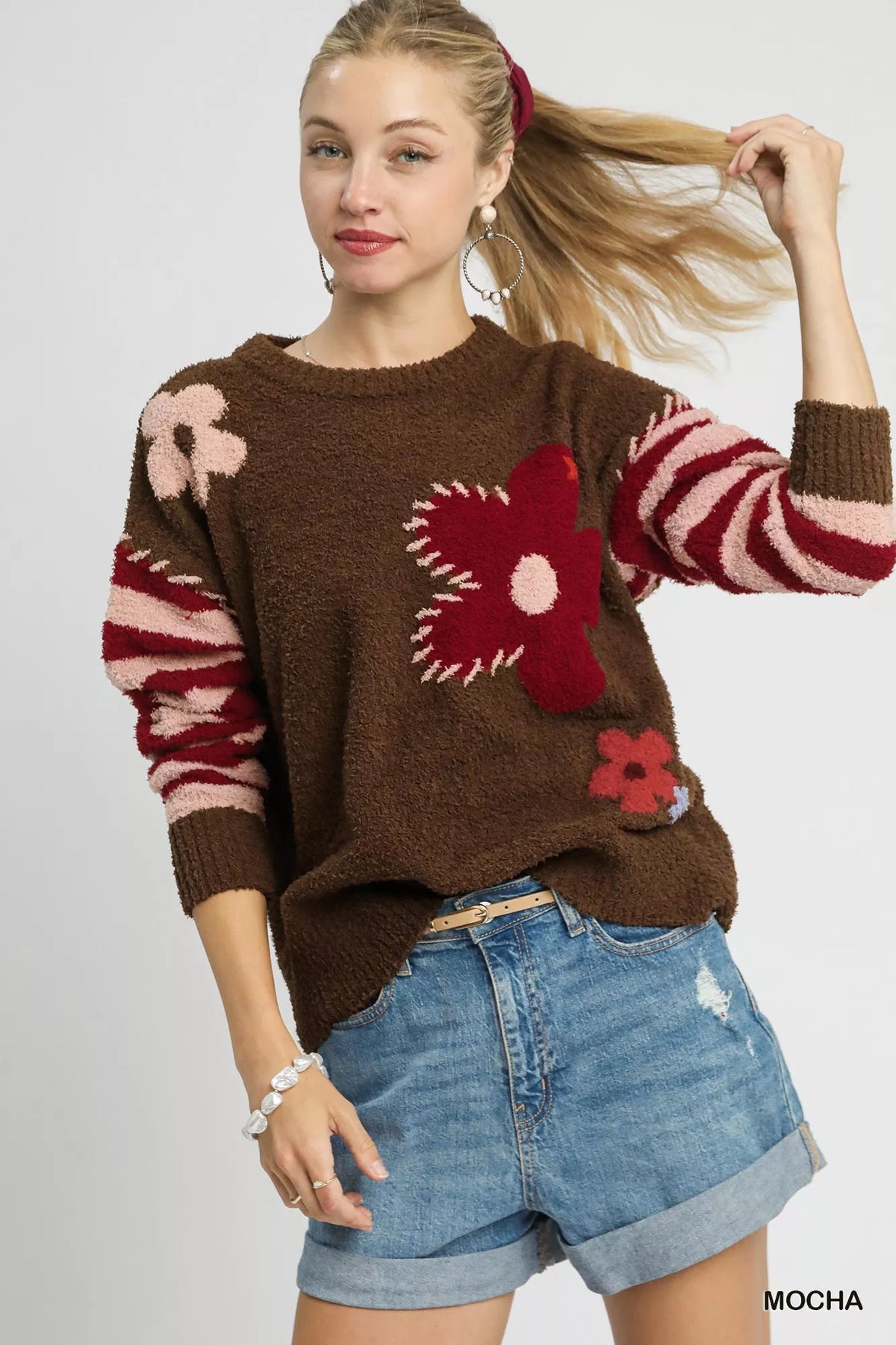 Mocha brown long-sleeve sweater with striped cuffs and red flower jacquard front