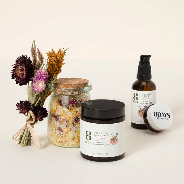 Skincare gift set with face lotion jar, balm jar, spray bottle, glass jar, dried bouquet