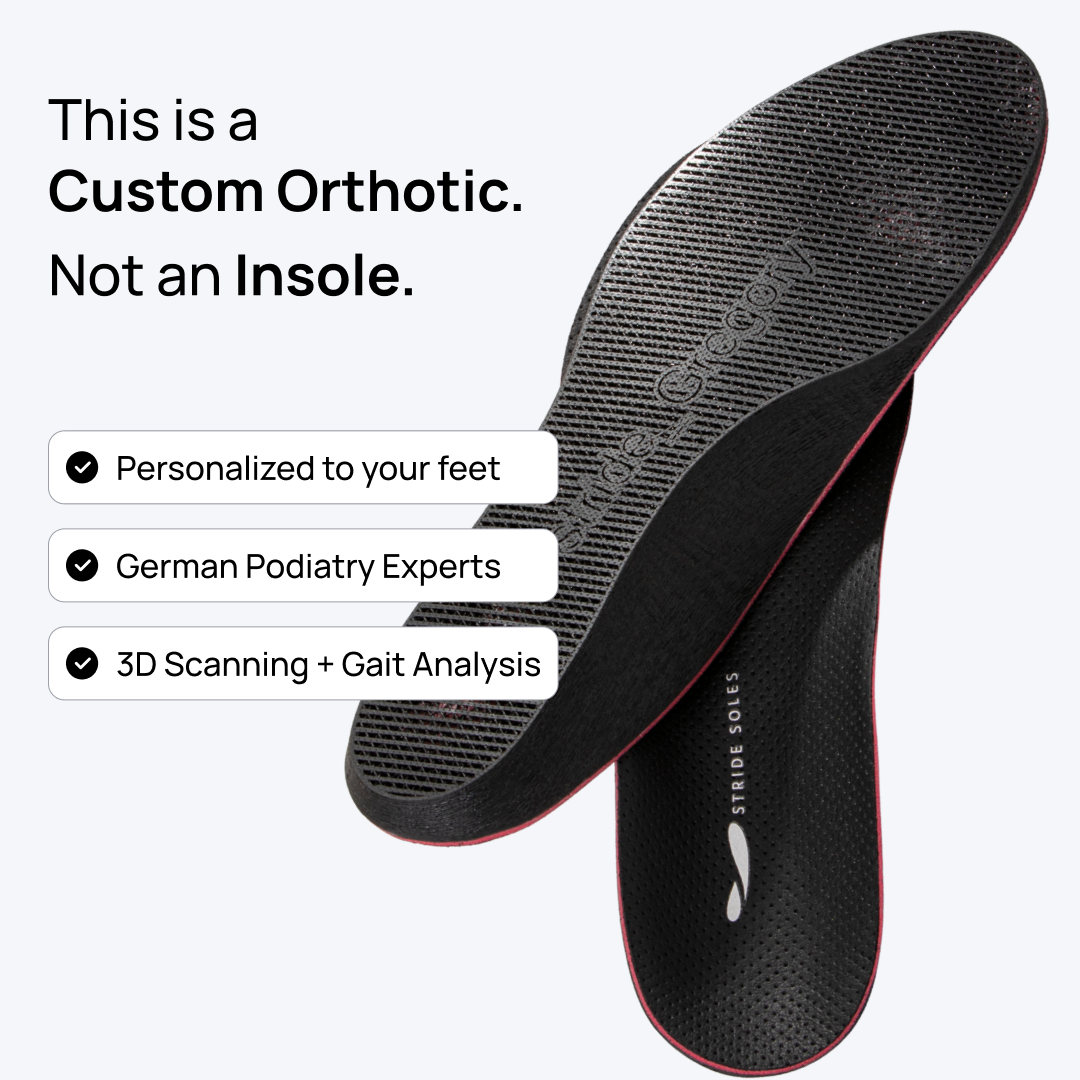 Pair of black perforated orthotic insoles with red edge trim