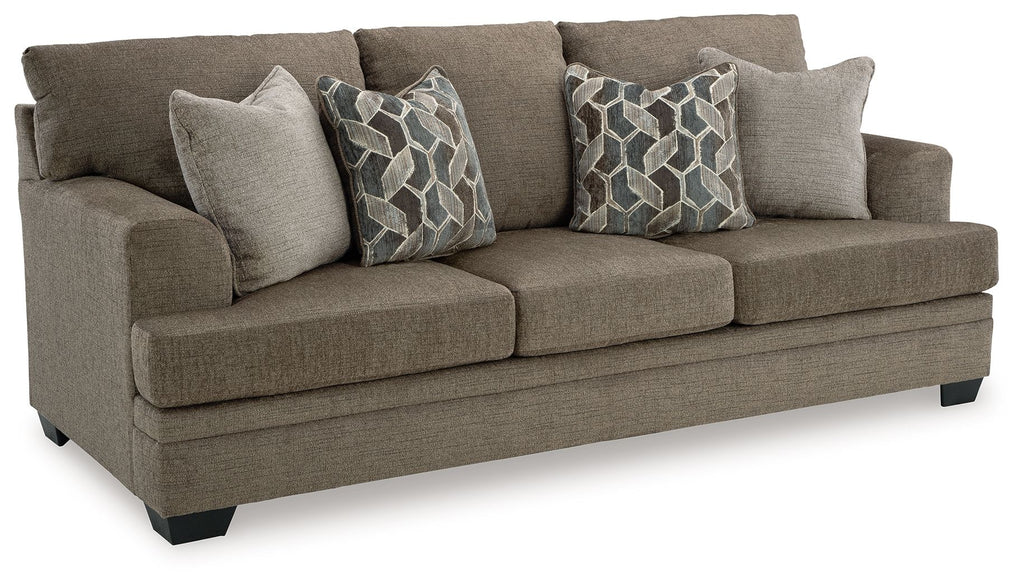 Stonemeade upholstered sofa with decorative geometric pillows in medium taupe