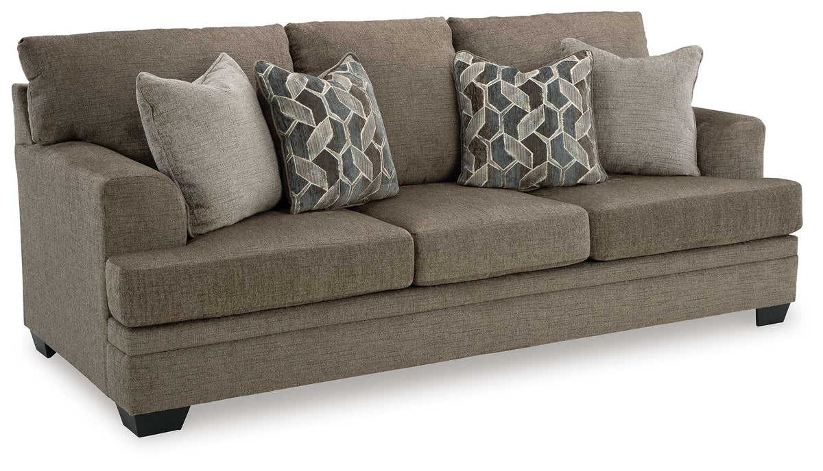 Stonemeade upholstered sofa with decorative geometric pillows in medium taupe