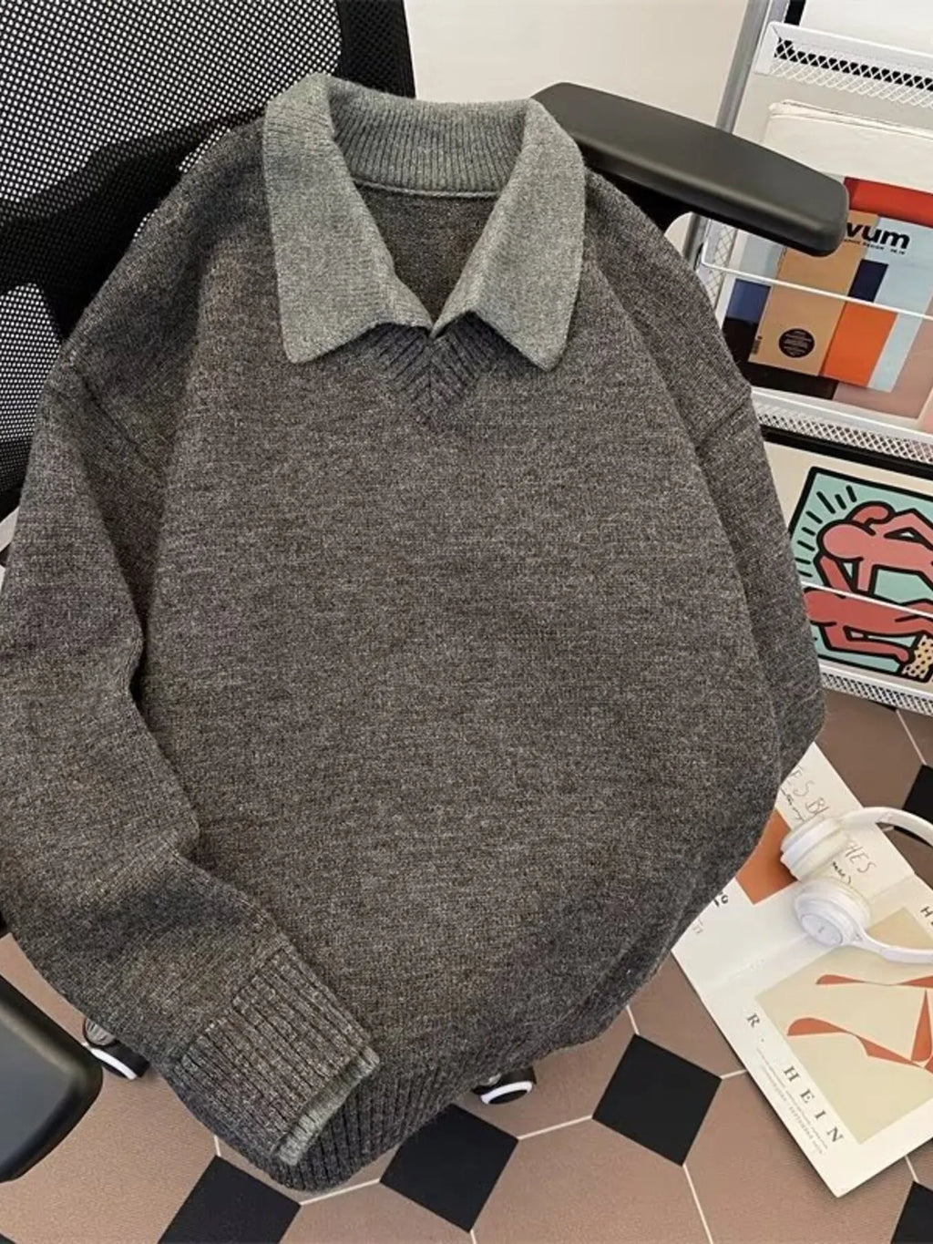 Gray long-sleeve knit sweater with ribbed hem and collared neckline