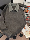 Gray long-sleeve knit sweater with ribbed hem and collared neckline