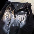 Black zip-up hooded cardigan with foamed front graphic and drawstring