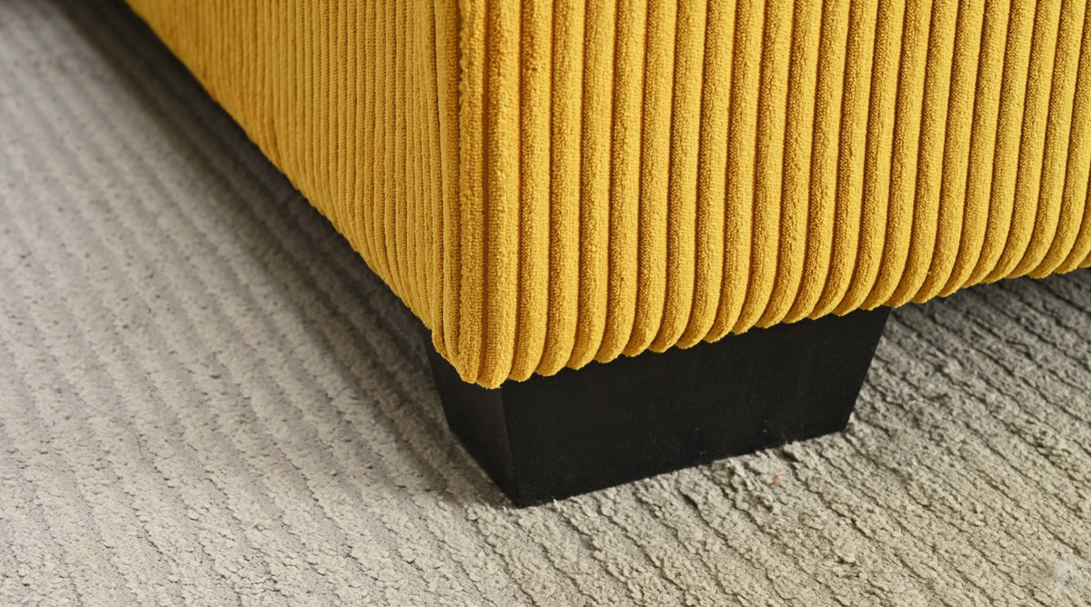Corduroy sectional chaise corner in mustard yellow with dark base