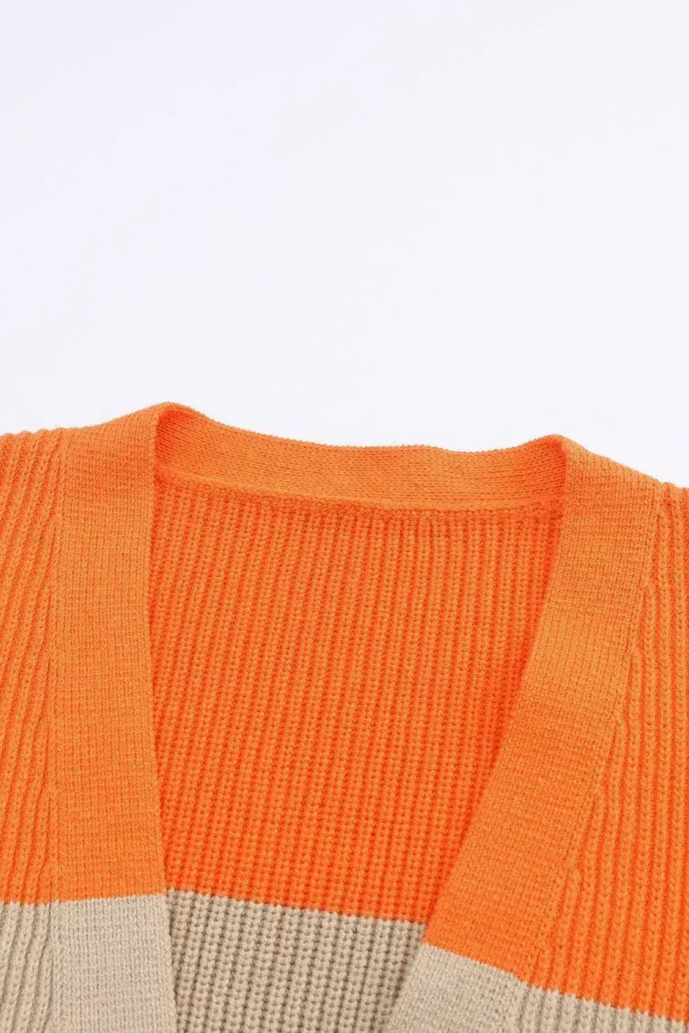 Open-front ribbed knit cardigan with orange and beige colorblock V-panel
