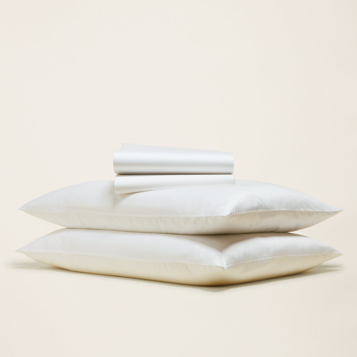 Luxe Australian sateen bedding bundle with cream pillowcases and folded top sheet