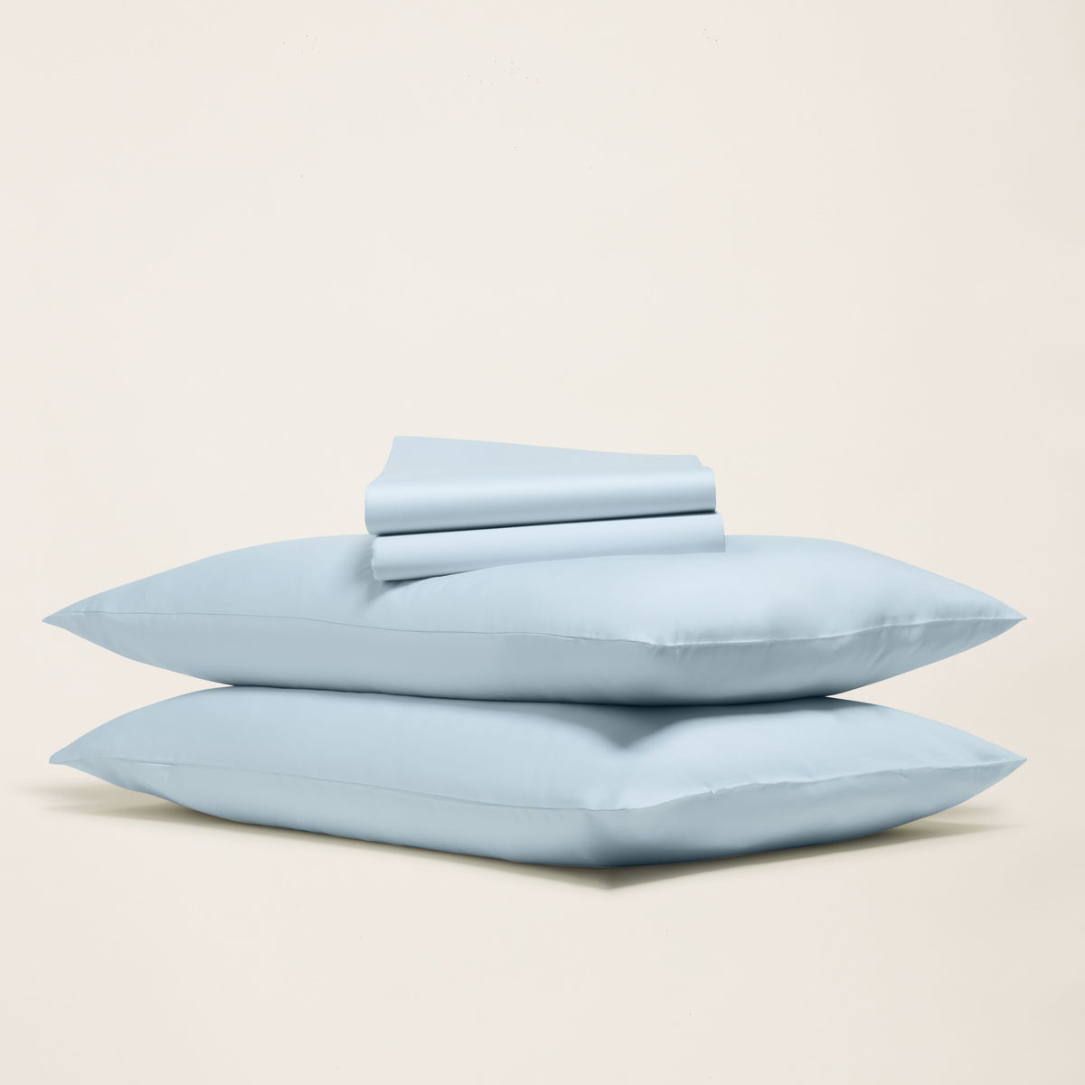 Pale blue solid sateen sheet set with folded top sheet and two pillowcases