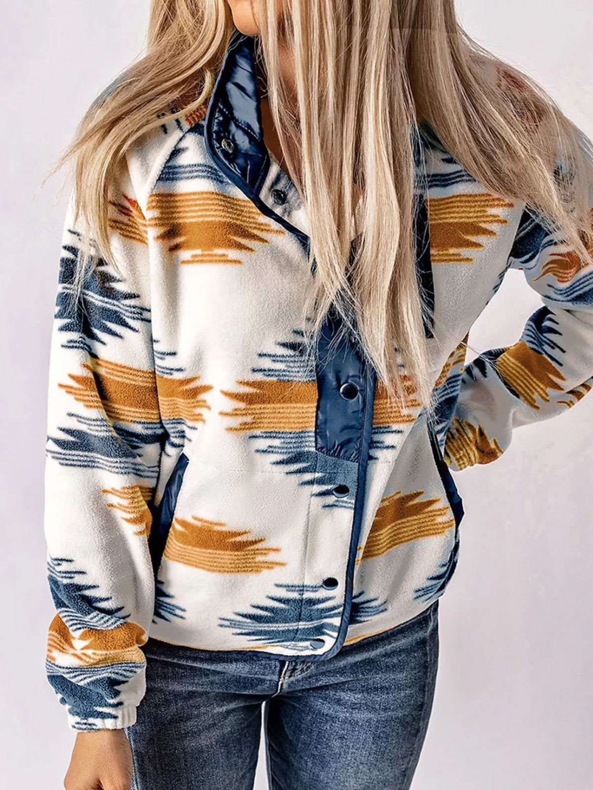 Geometric snap-down jacket blue with dark snaps and orange/navy geometric stripe pattern