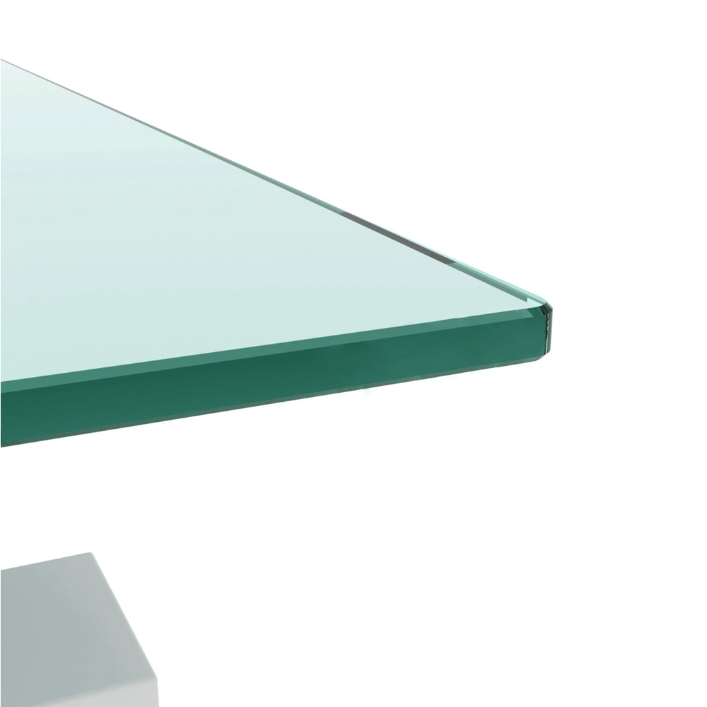 Clear glass tabletop edge on white coffee table with smooth corner finish