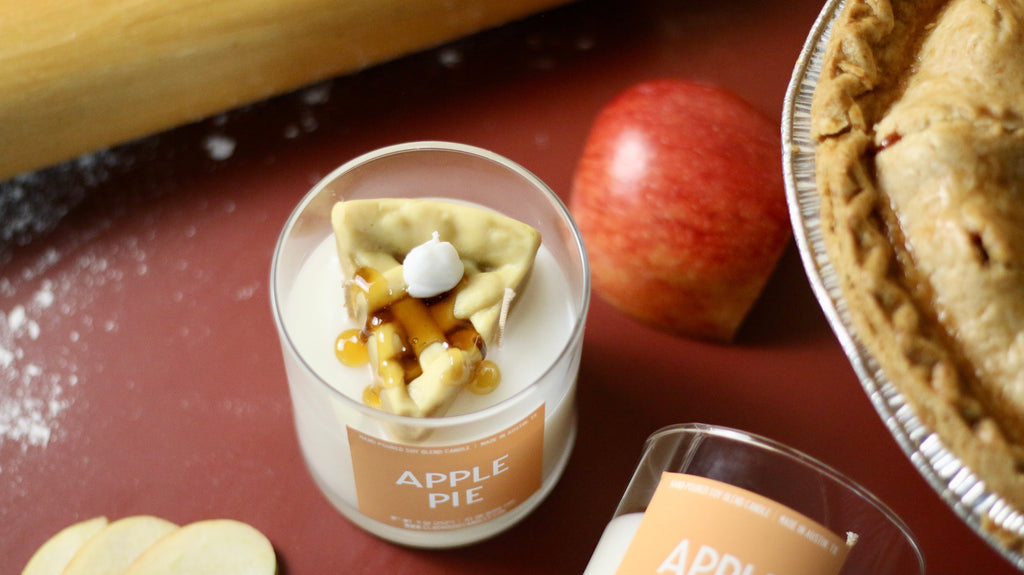 Apple pie container candle in clear glass holder with wax pieces and caramel drizzle