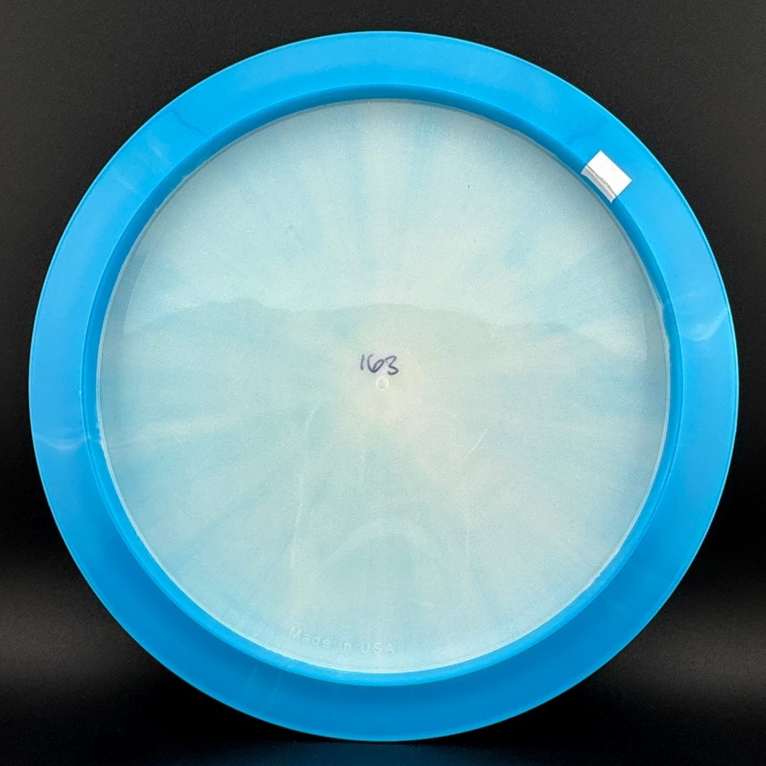 Light blue and clear disc golf disc bottom with faint inner markings