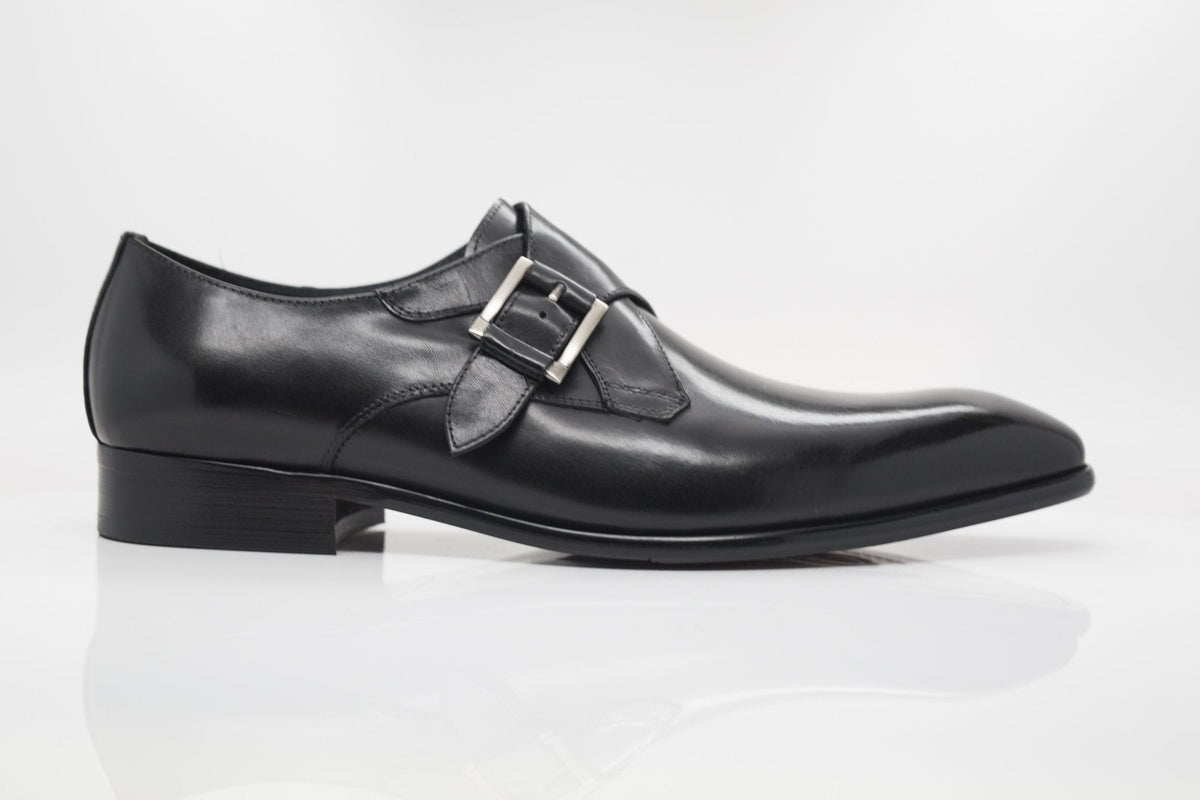Black monk strap leather dress shoe, three-quarter front view with buckle