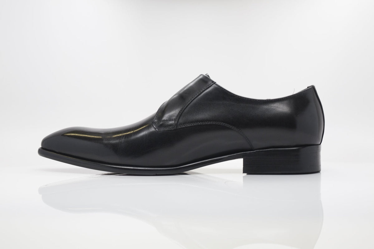 Black monk strap leather dress shoe, side profile with streamlined toe