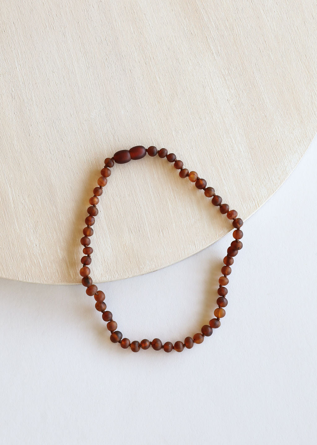 Raw amber bead necklace, cognac and dark brown round beads