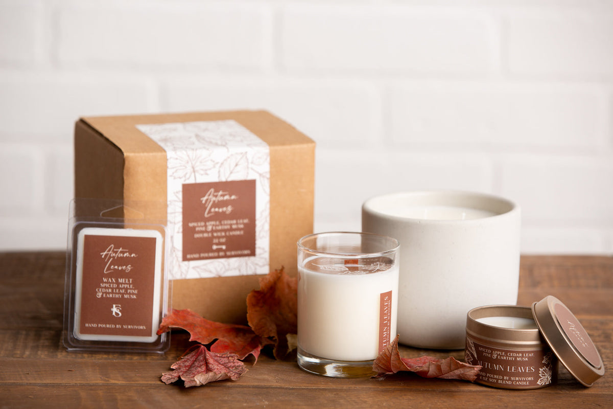 Autumn Leaves tin candle in gold metal jar with brown lid and label