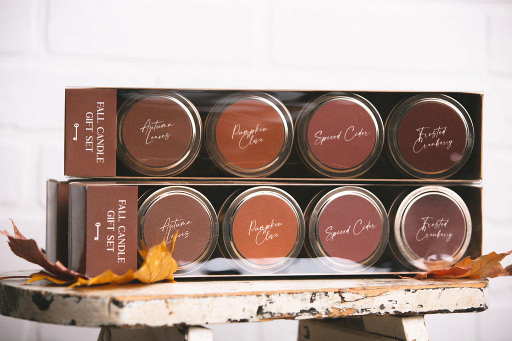 Candle tin set in gift box with four scents: Autumn Leaves, Pumpkin Clove, Spiced Cider, Cranberry