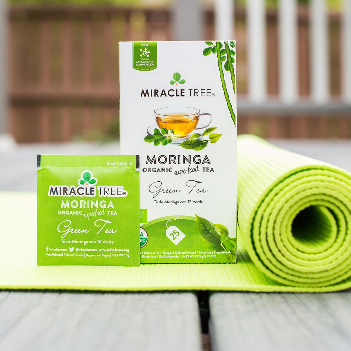 Miracle Tree moringa organic green tea boxes with tea cup illustration