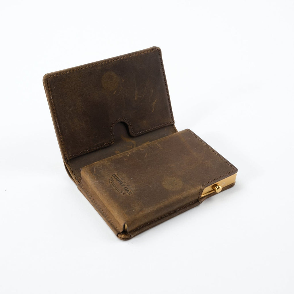 Brown bifold wallet with snap closure, showing interior card slots