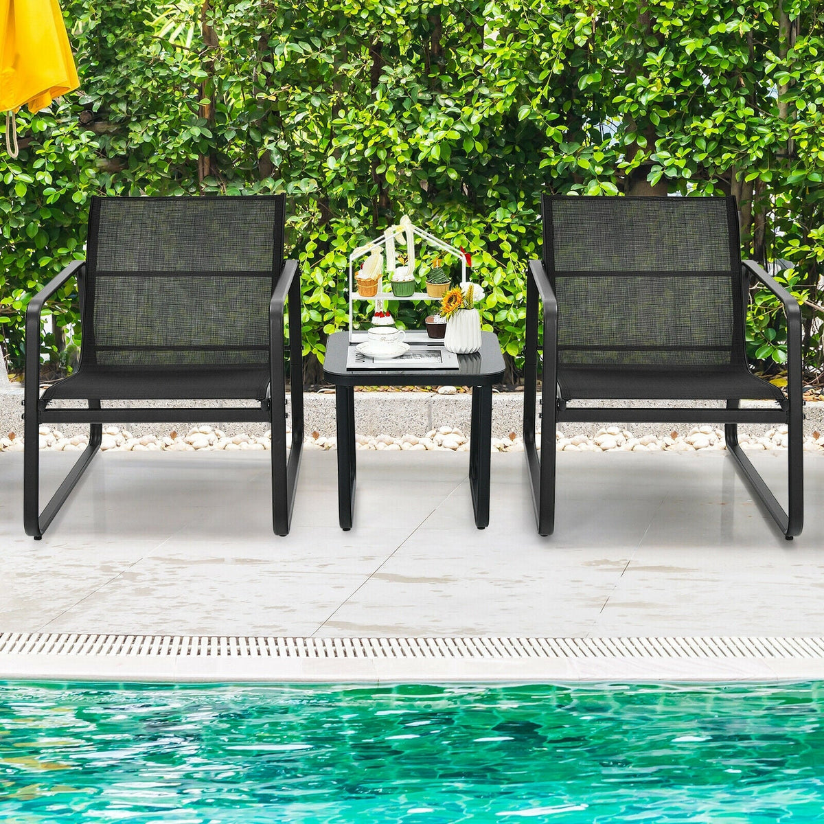 Black two-seat patio bistro set with two armchairs and glass top table
