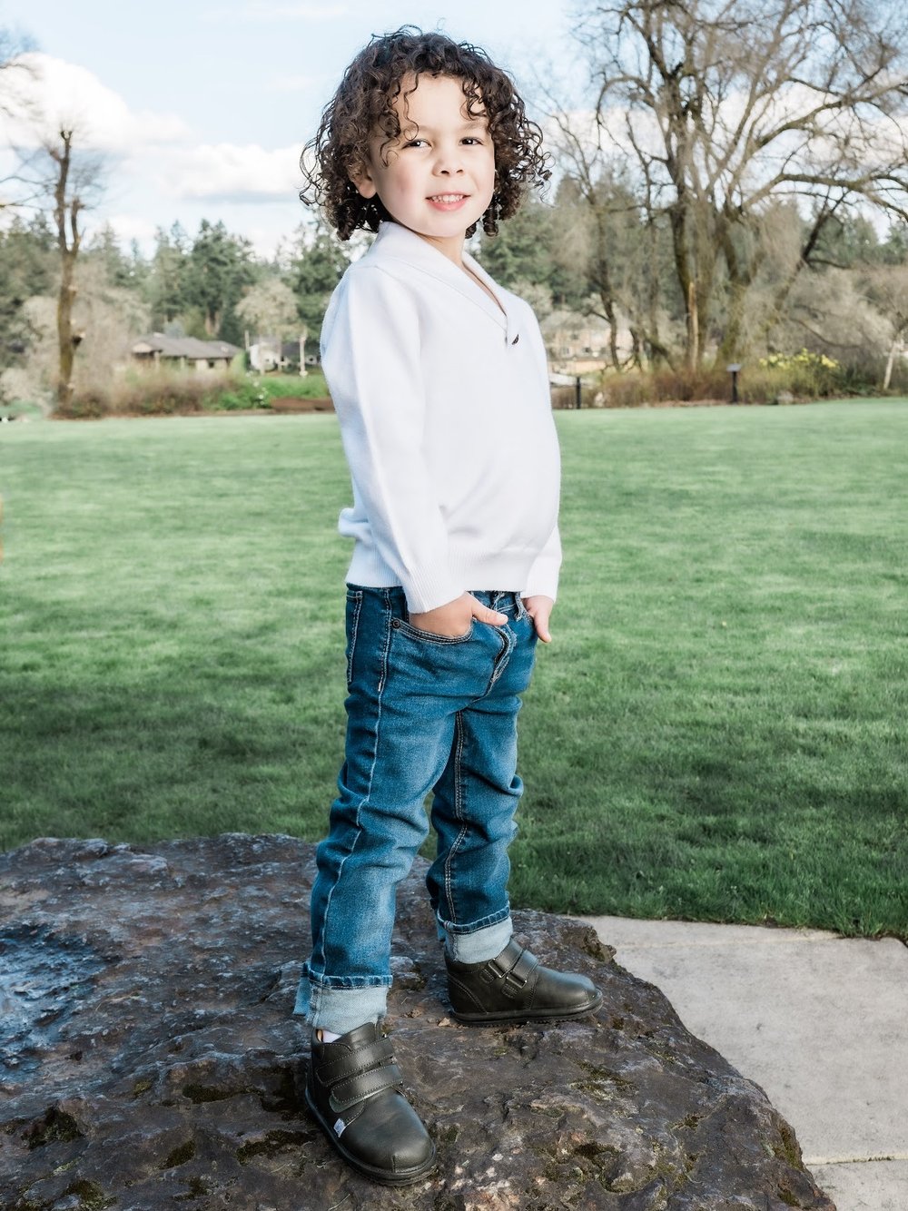 Kids dark slip-on barefoot shoes worn by child, lace-free design