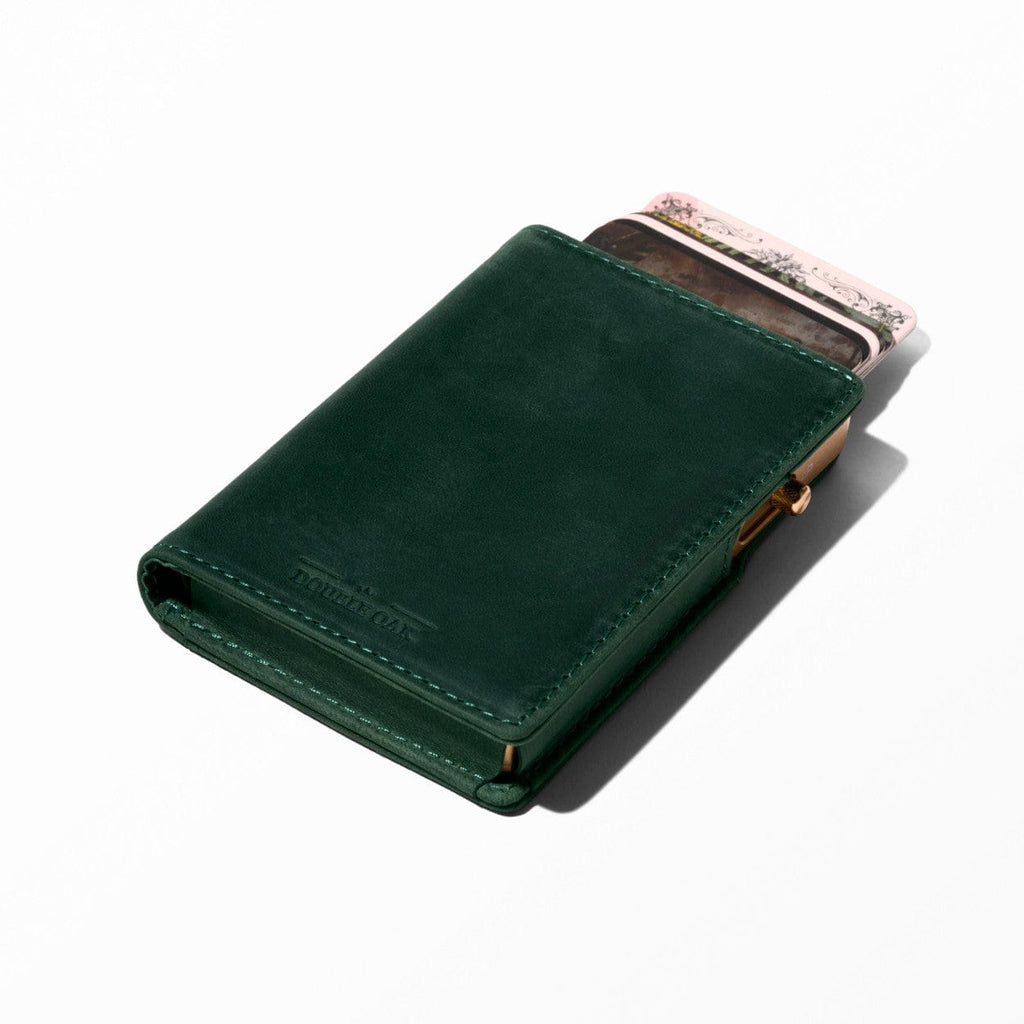Green bifold leather wallet with stitched edges and card slots visible