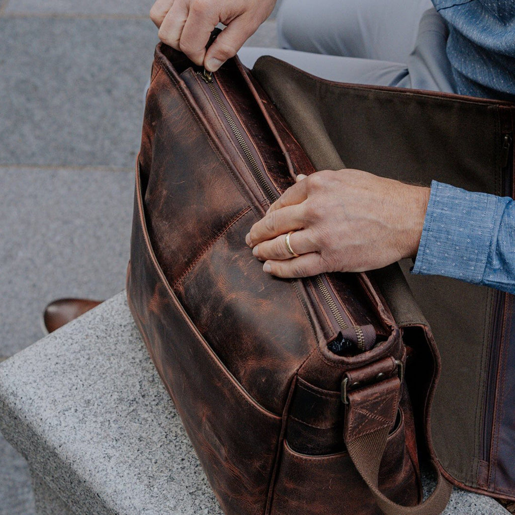 Wilson crossbody bag open, showing zip compartments and front organizer pocket