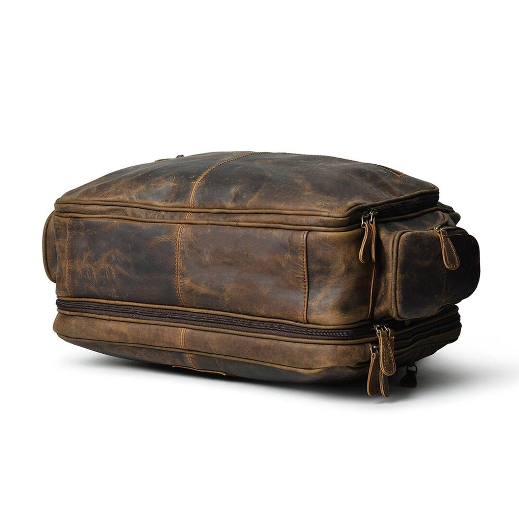 Brown leather briefcase showing back panel and side zipper detail
