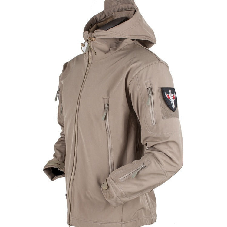 Three-in-one all-weather shell jacket in tan with zip front, hood, and sleeve patch