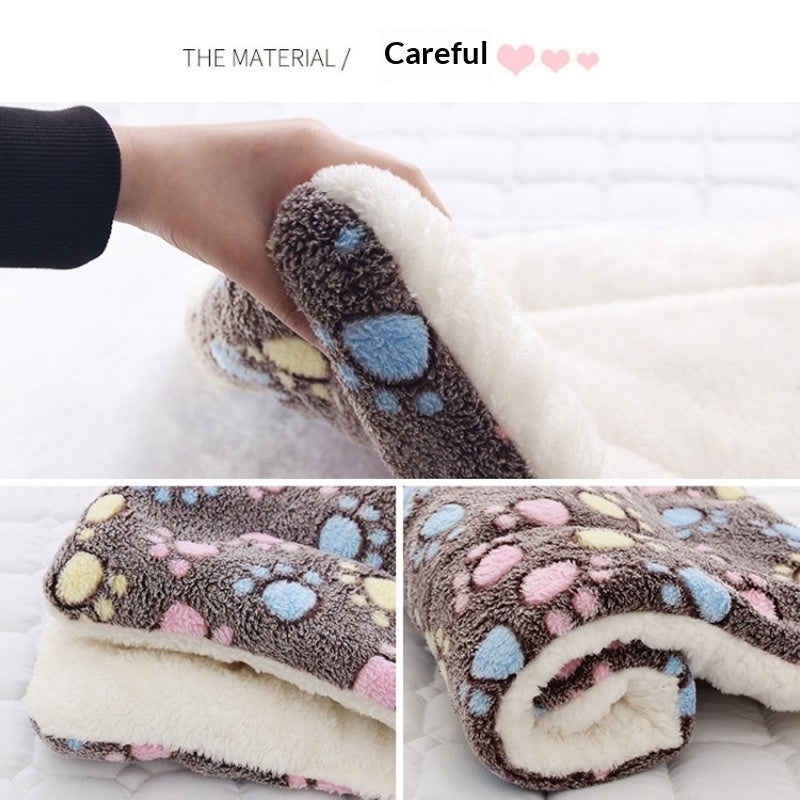 Rolled dark gray pet mat with paw-print pattern and soft plush fleece