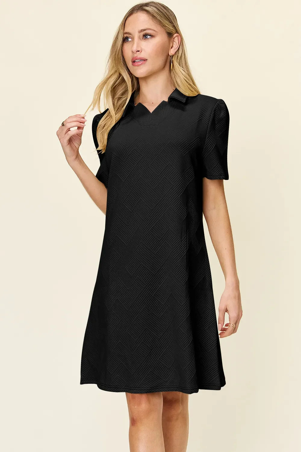 Black textured collared short-sleeve dress with buttoned collar, above-knee length
