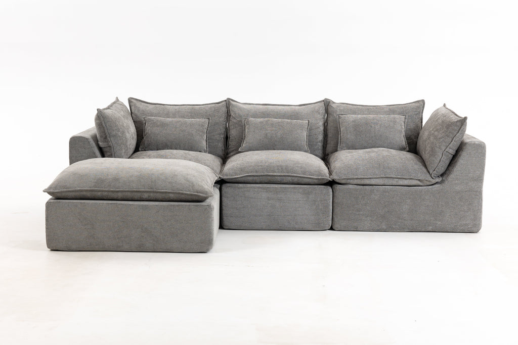 Gray sectional sofa with chaise armrests and back cushions; low-profile design