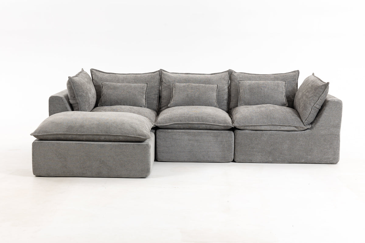 Gray sectional sofa with chaise armrests and back cushions; low-profile design