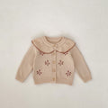 Stone powder baby knitted coat with embroidered flower motifs and ribbed Peter Pan collar