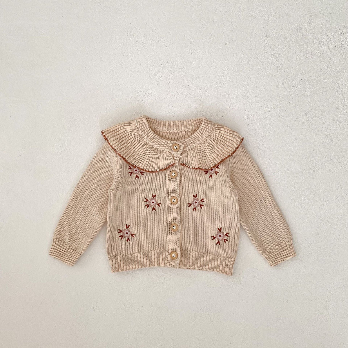 Stone powder baby knitted coat with embroidered flower motifs and ribbed Peter Pan collar
